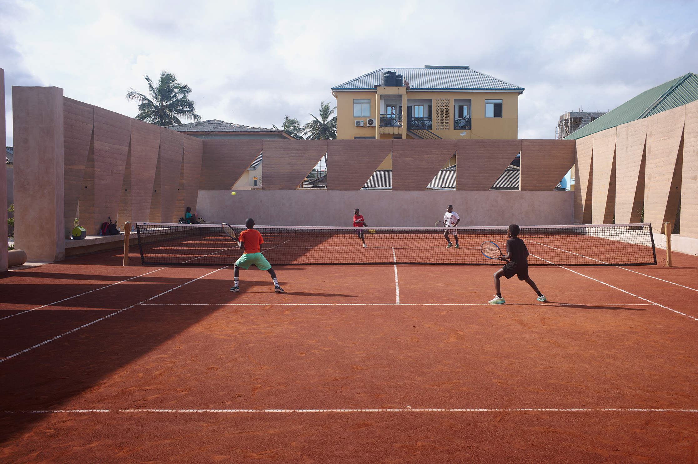 Backyard Community Club, Accra by DeRoche Projects, a sculptural tennis court